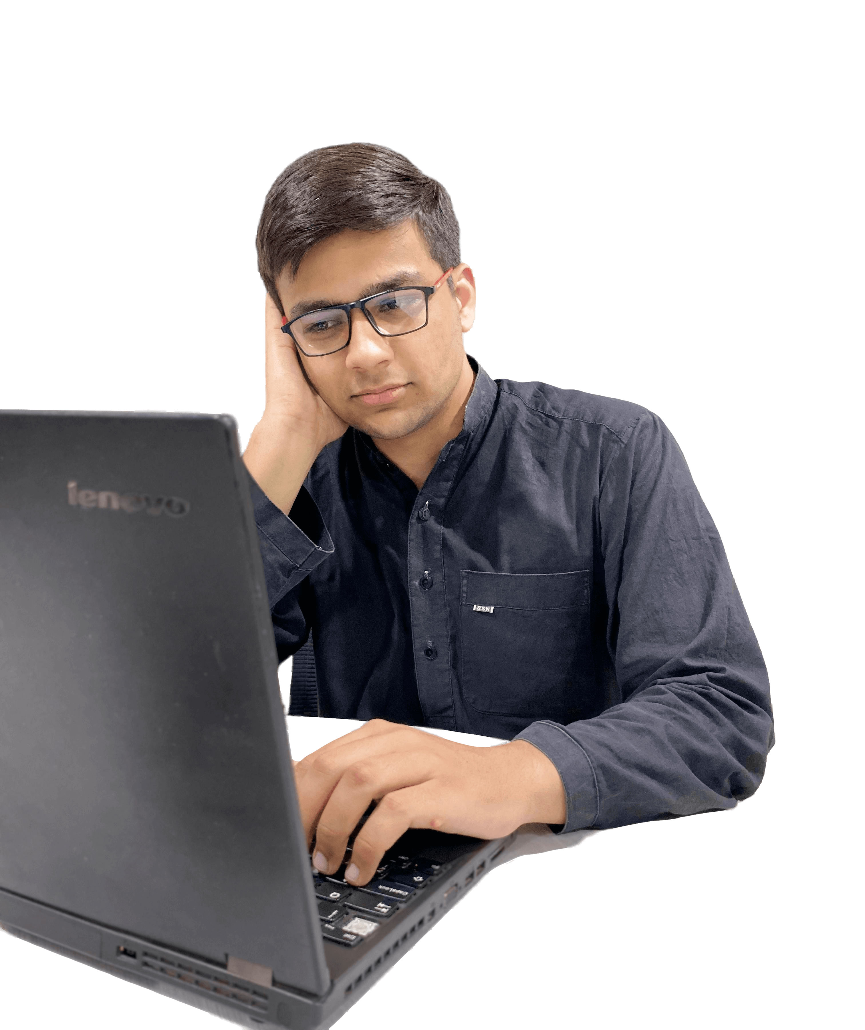 Muhammad Khan at work facing laptop